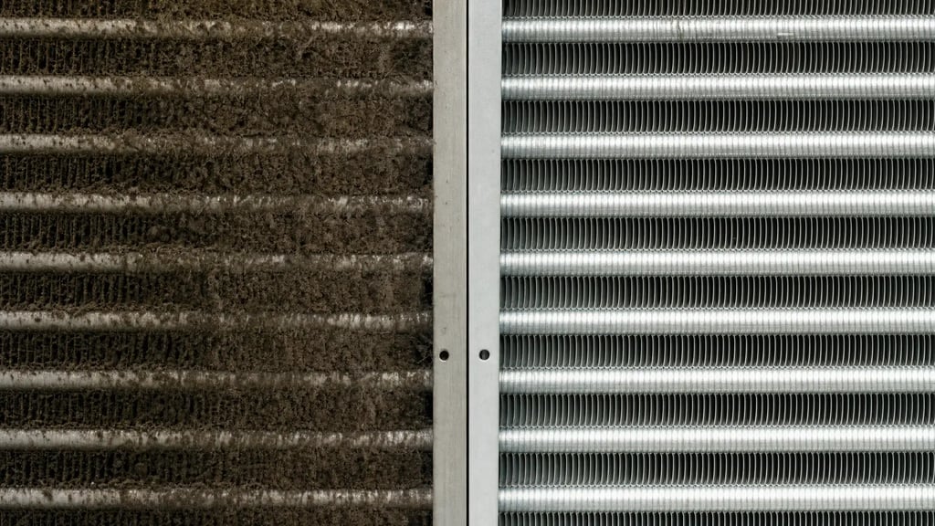 Side-by-side comparison of a clean and dirty commercial HVAC cooling coil