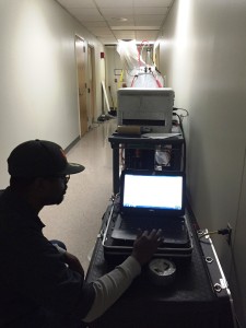 STC technician monitoring the injection of a vinyl acetate polymer during duct sealing process