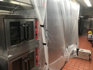 industrial oven covered and getting cleaned