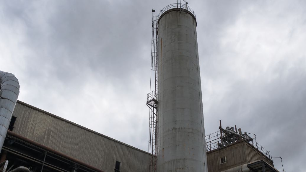 Industrial exhaust stack and vessel structure showing a hard-to-reach spot requiring rope access maintenance