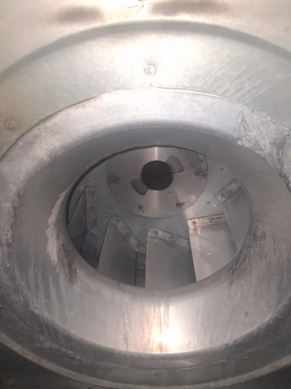 After: the same blower wheel with bare, clean blades after Service-Tech air duct cleaning