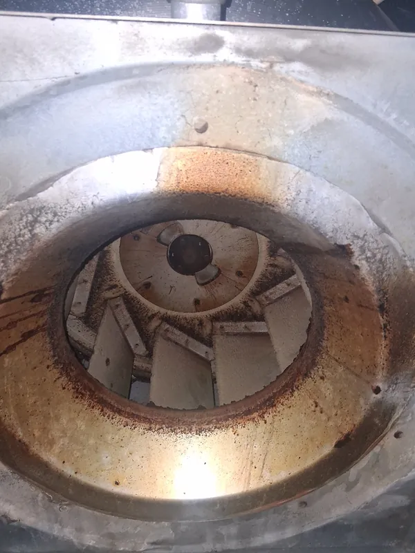 Before: HVAC blower wheel coated in buildup before Service-Tech air duct cleaning