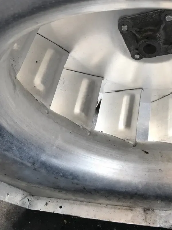 After: the same exhaust fan cleaned to bare metal by Service-Tech