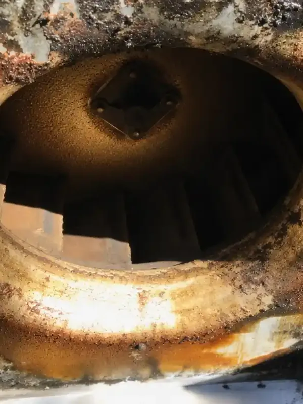 Before: kitchen exhaust fan housing with baked-on grease